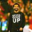 Mo Salah wearing a 'Never Give Up' t-shirt.